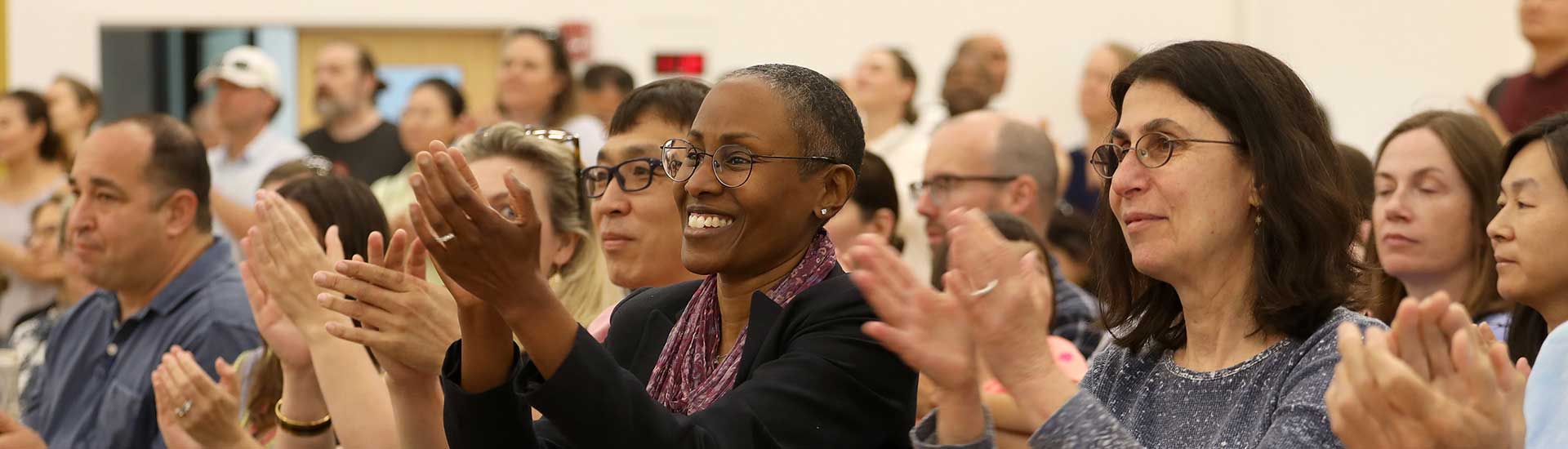 Parents applaud as their children move up to the next grade